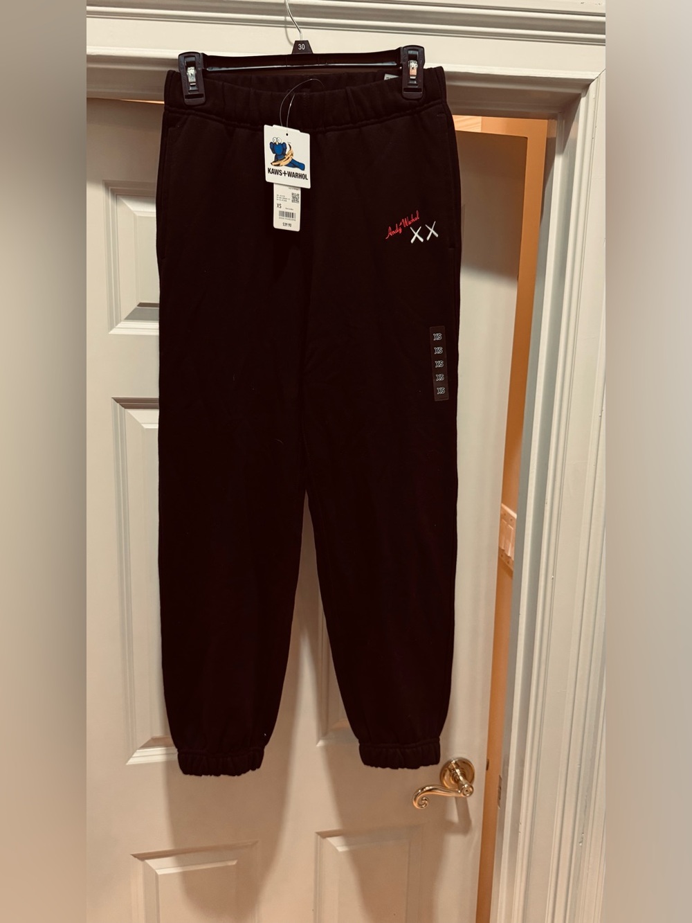 KAws and Warhol collab Black Sweat Joggers with Red Script Accent